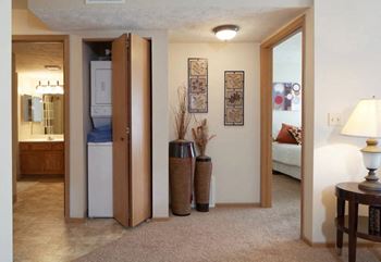 a living room with a view of a bathroom and a bedroom